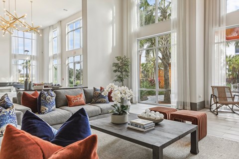 A living room with a grey sofa and a coffee table in front of it.